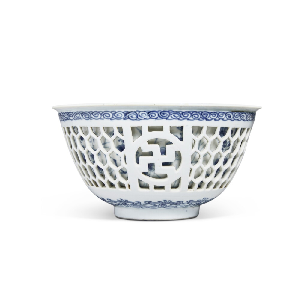 View full screen - View 1 of Lot 112. A blue and white double-walled reticulated 'floral' bowl, Qing dynasty, Kangxi period.