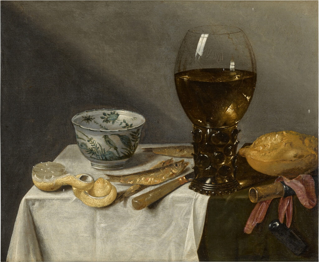 View full screen - View 1 of Lot 126. Still life with a roemer, porcelain bowl, fish and peeled lemon on a table draped with a white cloth.