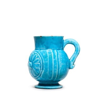 View full screen - View 1 of Lot 84. A Safavid turquoise jug with moulded decoration, Persia, 17th century.