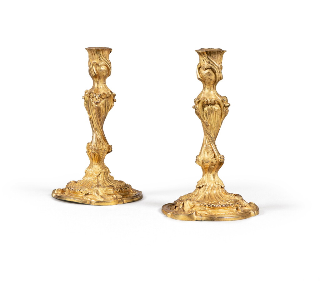 View full screen - View 1 of Lot 48. A pair of Louis XV gilt-bronze candlesticks, marked with the C couronné poinçon | Paire de flambeaux en bronze doré Louis XV, marqués au C couronné.