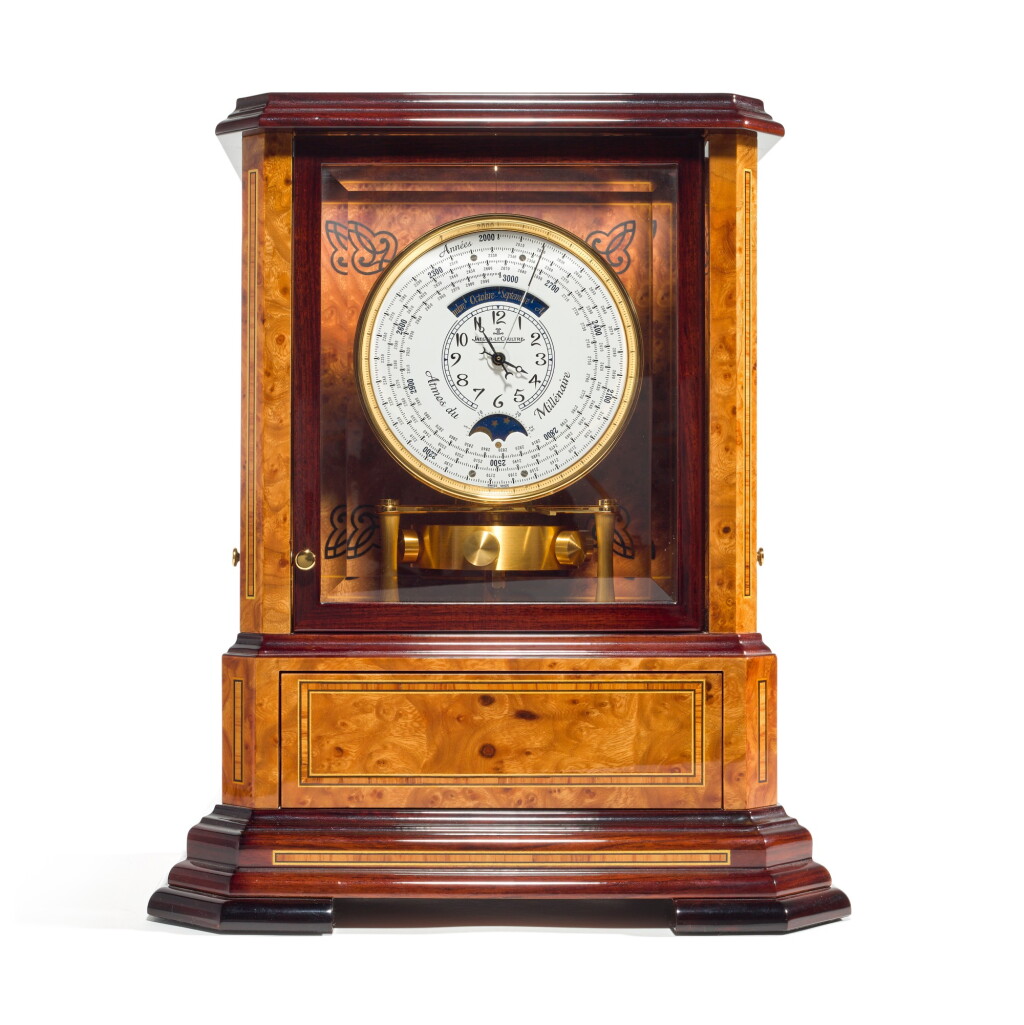 View full screen - View 1 of Lot 82. REFERENCE 5523101 ATMOS DU MILLÉNAIRE A VERY FINE LIMITED EDITION ART NOUVEAU STYLE WOOD, GILT BRASS AND GLASS ATMOS CLOCK WITH 1000 YEAR CALENDAR AND MOON PHASES, CIRCA 2000.