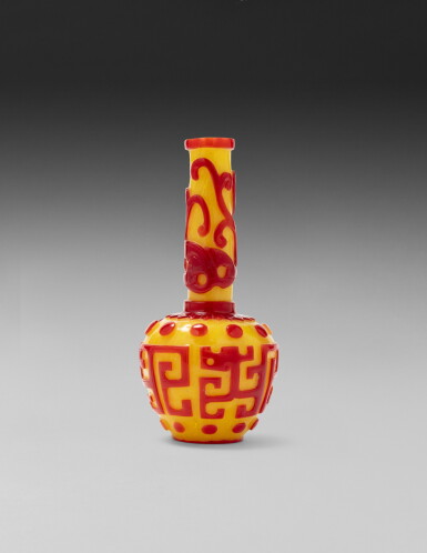 View full screen - View 1 of Lot 206. A small red overlay yellow ground archaistic 'chilong' bottle vase Qing dynasty, 19th century | 清十九世紀 黃地套紅料仿古螭龍紋直頸小瓶 《乾隆年製》仿款.