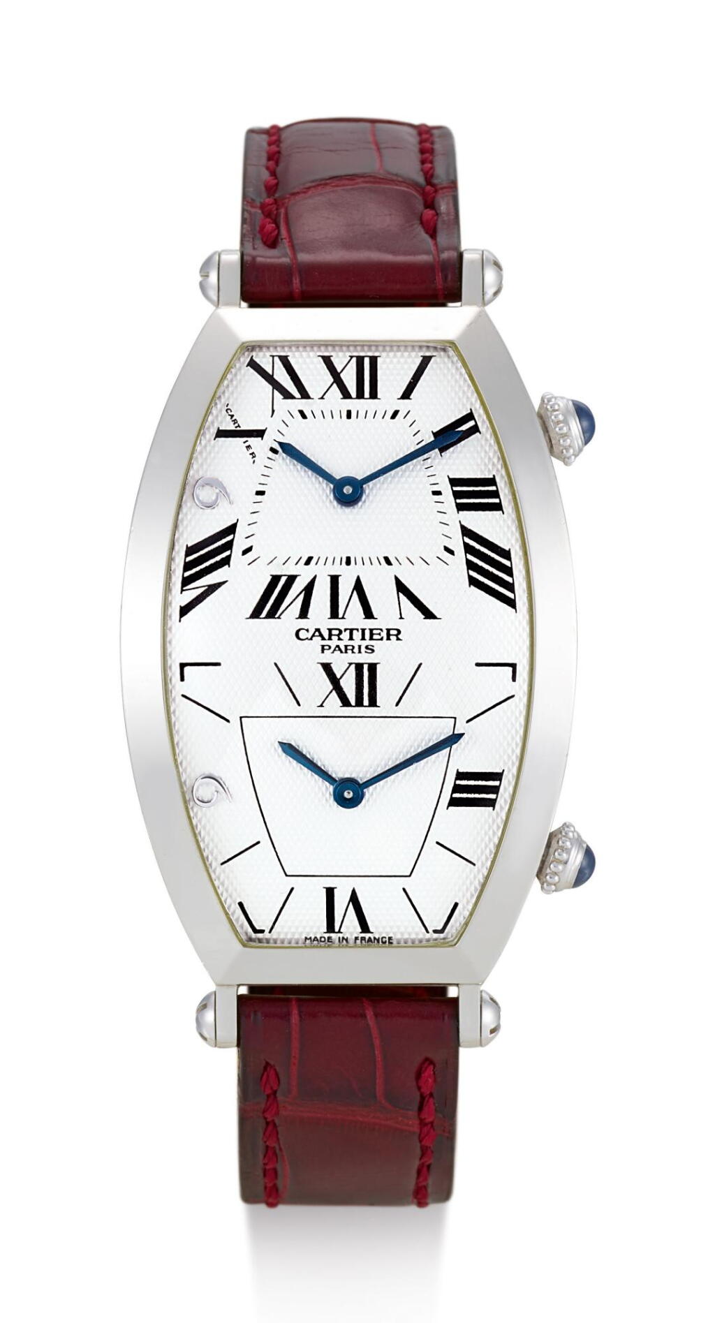 View full screen - View 1 of Lot 8105. CARTIER | COLLECTION PRIVÉE - TONNEAU TWO TIME ZONES, REFERENCE 2487, A LIMITED EDITION PLATINUM DUAL TIME ZONE WRISTWATCH, MADE TO COMMEMORATE MACAU'S HANDOVER TO THE PEOPLE'S REPUBLIC OF CHINA, MADE IN 1999.