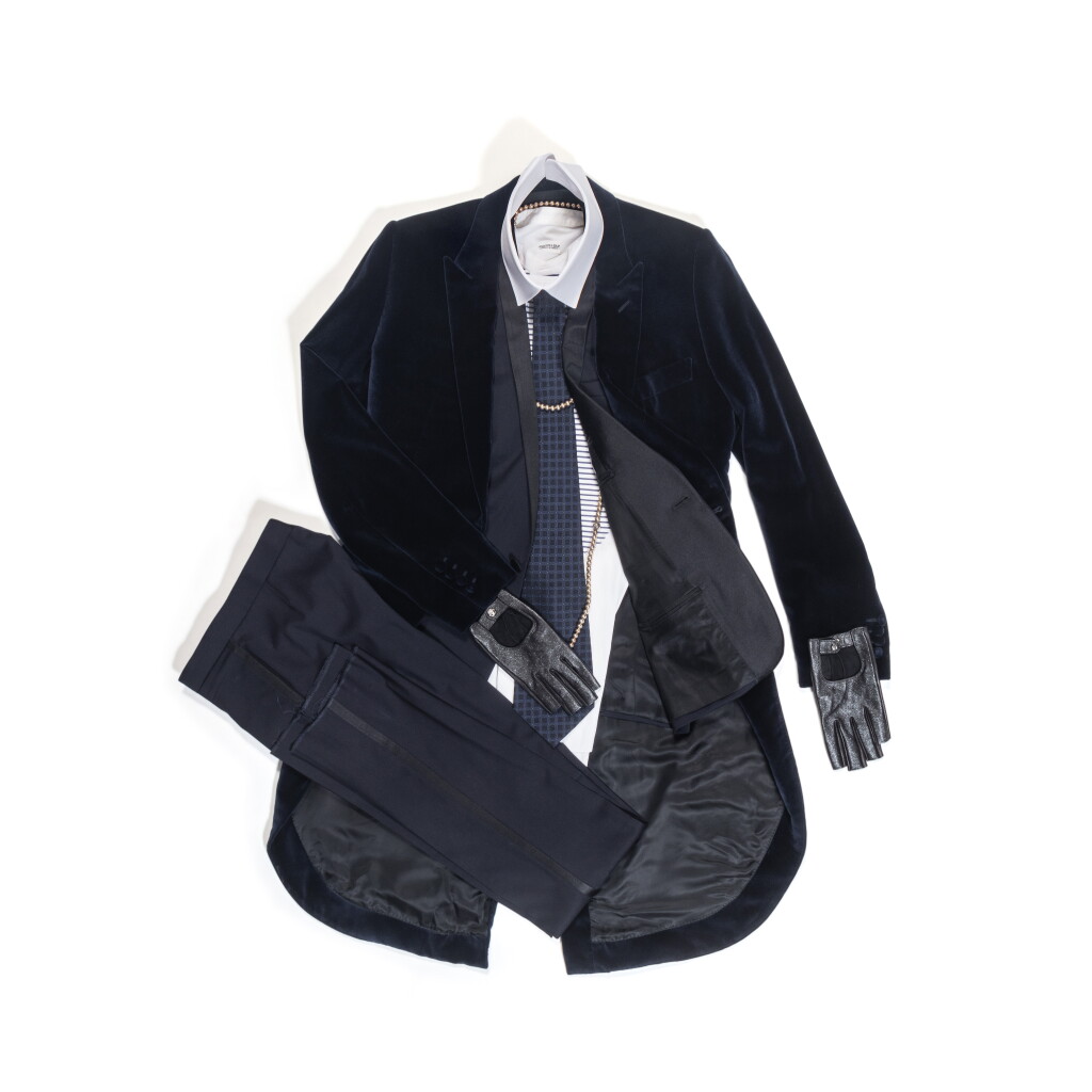 View full screen - View 1 of Lot 72. Karl Lagerfeld’s Total Look 10 "Velvet Underground " : Dior, Navy Suit and Navy Velvet Tail Coat; Hilditch & Key, Striped Shirt and White Collar; Chanel, Navy Satin Tie; Causses, Gloves & Tiffany, Silver Plated Necklace.