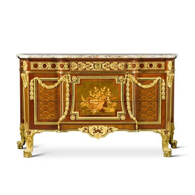 View full screen - View 1 of Lot 225. A Louis XVI style gilt-bronze-mounted mahogany, amaranth and marquetry commode, first half 20th century, by Fernand Blondeau, after a model by Jean-Henri Riesener .
