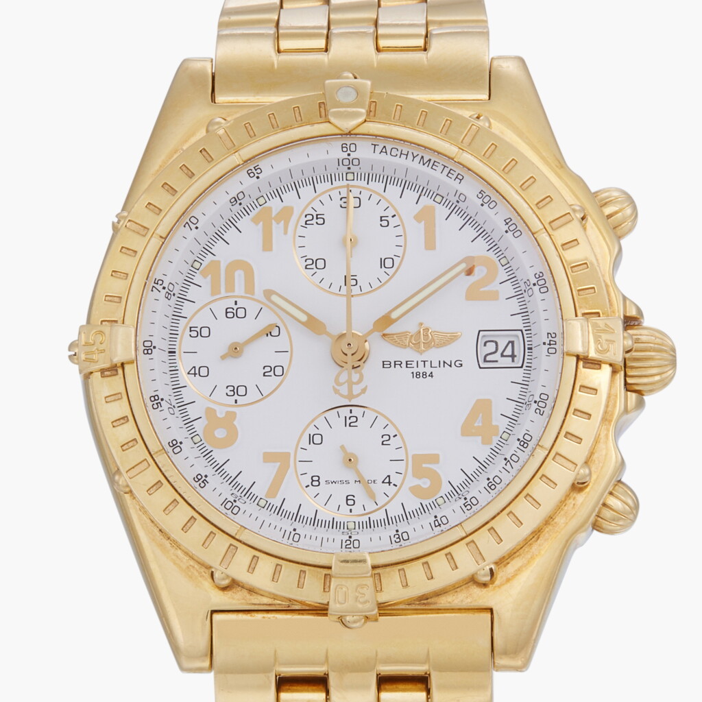 View full screen - View 1 of Lot 299. Chronomat, Reference K13050.1A | A yellow gold chronograph wristwatch with date and bracelet | Circa 2001.