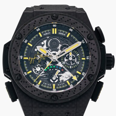View full screen - View 1 of Lot 176. Reference 719.QX.1729.NR.AES10 Big Bang ‘King Power Ayrton Senna’ | A limited edition carbon fibre and black ceramic semi-skeletonised split seconds chronograph wristwatch with power reserve indication, Circa 2010.