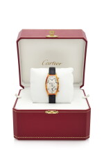 TONNEAU DUAL TIME ZONE, REFERENCE 116-88 YELLOW GOLD TONNEAU-SHAPED DUAL TIME ZONE WRISTWATCH (OROLOGIO DA POLSO IN ORO GIALLO MODELLO ‘TONNEAU’ CON DOPPIO FUSO ORARIO) CIRCA 1990 | CARTIER, PARIS