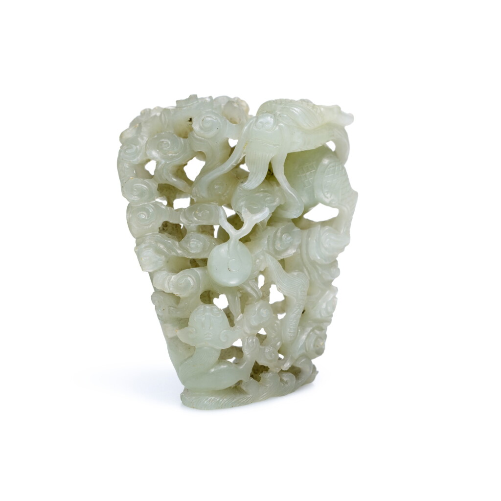 View full screen - View 1 of Lot 218. A RETICULATED JADE 'DRAGON' FINIAL, 17TH CENTURY | 十七世紀 青玉鏤雕蒼龍教子紋爐頂.