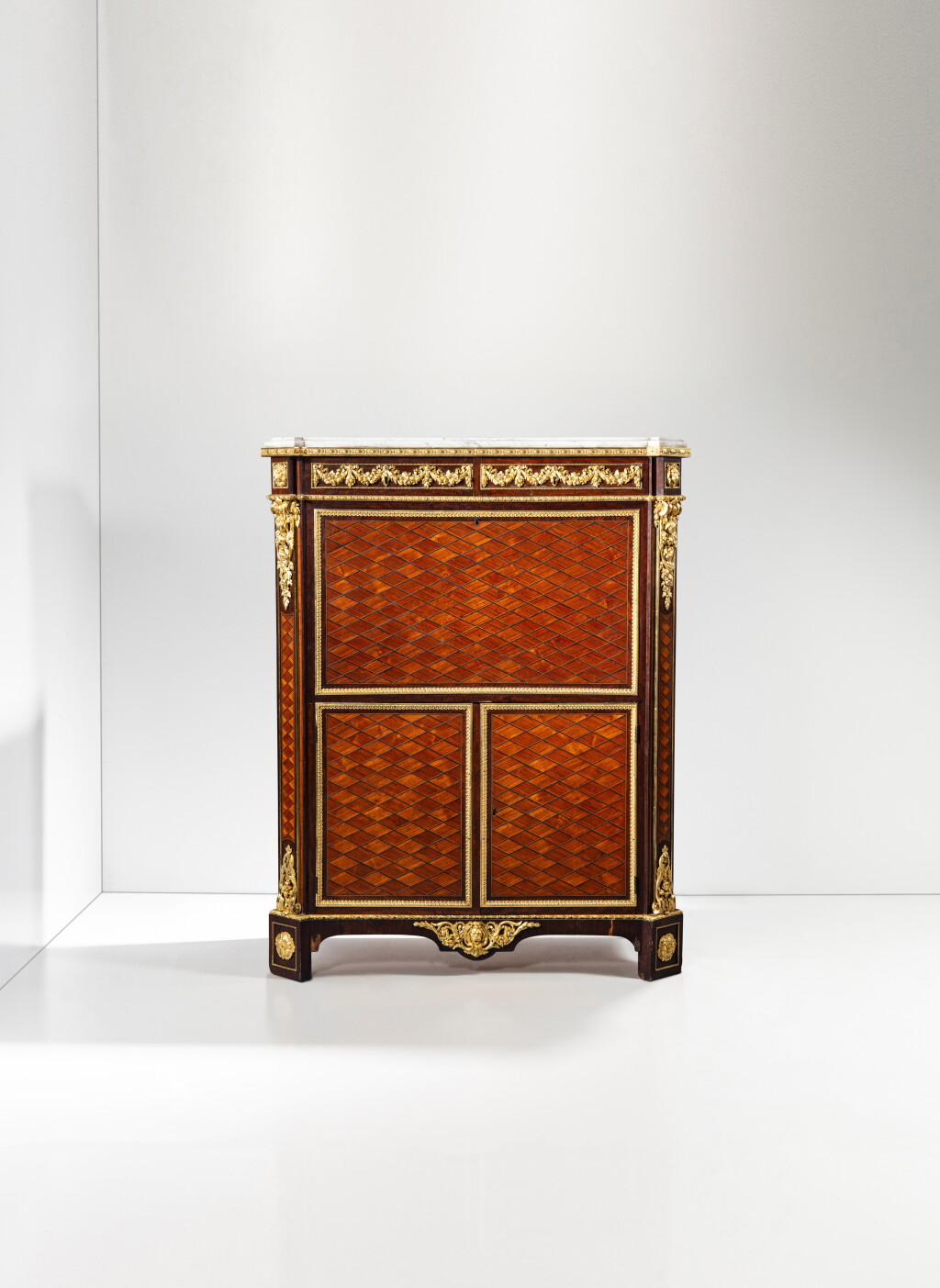 View full screen - View 1 of Lot 20. An important Louis XVI gilt-bronze mounted tulipwood, amaranth and hollywood mosaic-shaped marquetry secrétaire à abattant, circa 1780-1785, stamped by Jean-Henri Riesener.