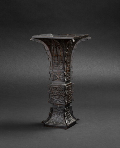 View full screen - View 1 of Lot 79. Vase archaïsant en bronze patiné, gu Dynastie Qing, XVIIIE siècle | 清十八世紀 銅仿古紋出戟花觚 | A large bronze gu vase, Qing Dynasty, 18th century.