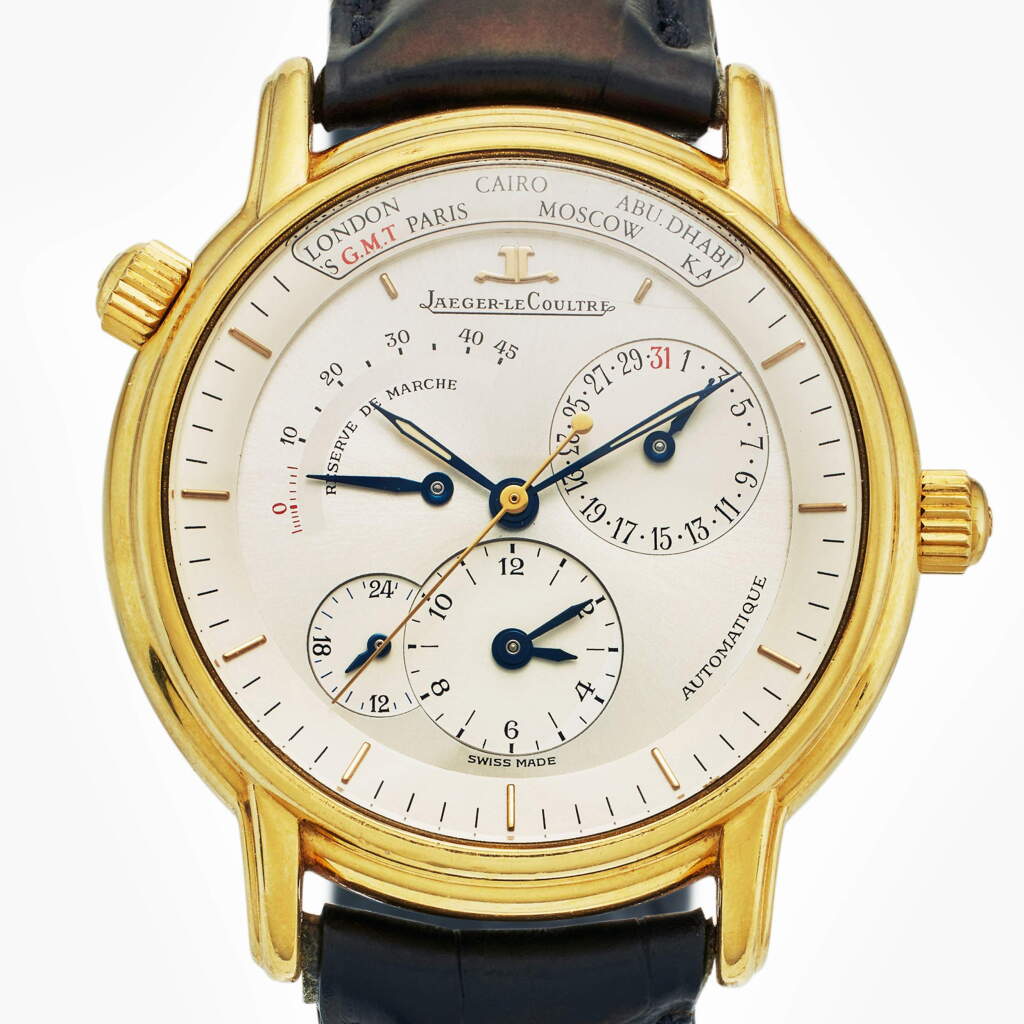 View full screen - View 1 of Lot 464. Reference 169.1.92 Géographique | A yellow gold automatic dual time zone wristwatch with date, 24-hour and power reserve indication, Circa 1990.