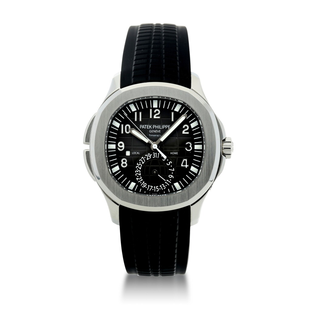 View full screen - View 1 of Lot 68. REFERENCE 5164 AQUANAUT TRAVEL TIME RETAILED BY TIFFANY & CO: A STAINLESS STEEL DUAL TIME ZONE WRISTWATCH WITH DATE AND DAY/NIGHT INDICATION, CIRCA 2015.