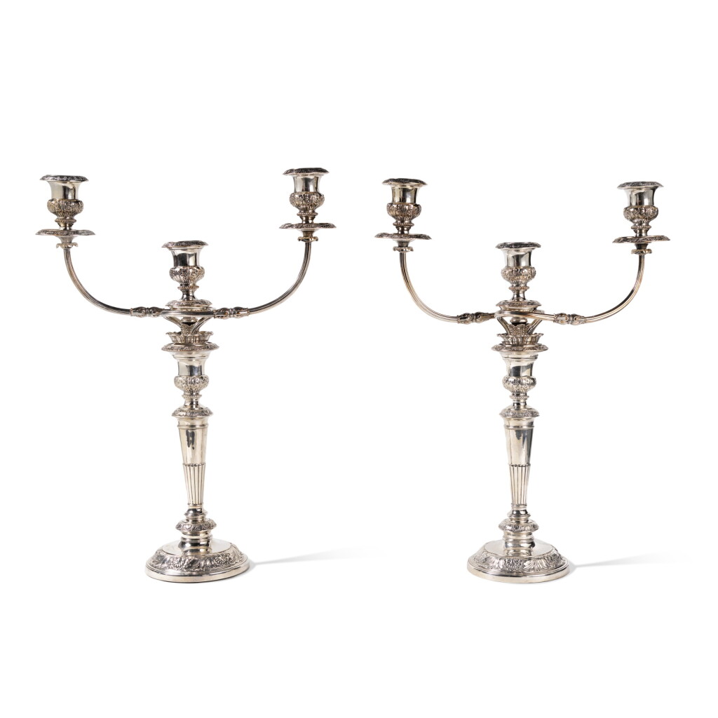View full screen - View 1 of Lot 1820. A Pair of Regency Silver Candlesticks with Sheffield Plated Three-Light Tops, G. Smith, R. Tate, W. Nicholson and E. Hoult, Sheffield, 1814.