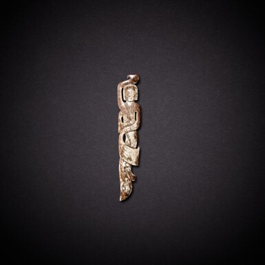 View full screen - View 1 of Lot 5655. A russet jade 'dancer' pendant, Han dynasty | 漢 玉舞女珮.
