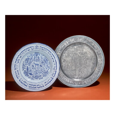 View full screen - View 1 of Lot 68. A CONTINENTAL BLUE AND WHITE DELFTWARE PASSOVER PLATE AND AN ALSATIAN PEWTER PASSOVER PLATE, DATED 1858 AND CIRCA 1802.