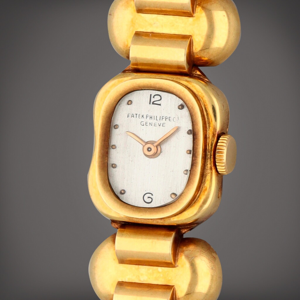 View full screen - View 1 of Lot 272. Reference 2163 | A yellow gold wristwatch with bracelet | Circa 1946.