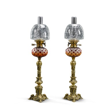 View full screen - View 1 of Lot 67. A pair of Victorian brass and ruby cut-glass 'Hink's Duplex Patent' oil lamps, circa 1885.