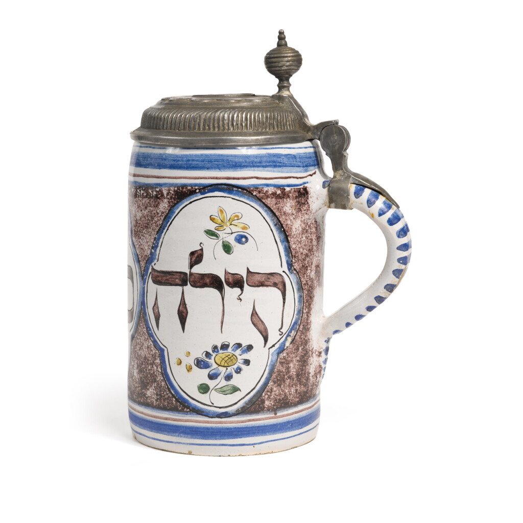 View full screen - View 1 of Lot 101. A Pewter-Mounted German Faience Tankard with Hebrew Names, dated 1788.