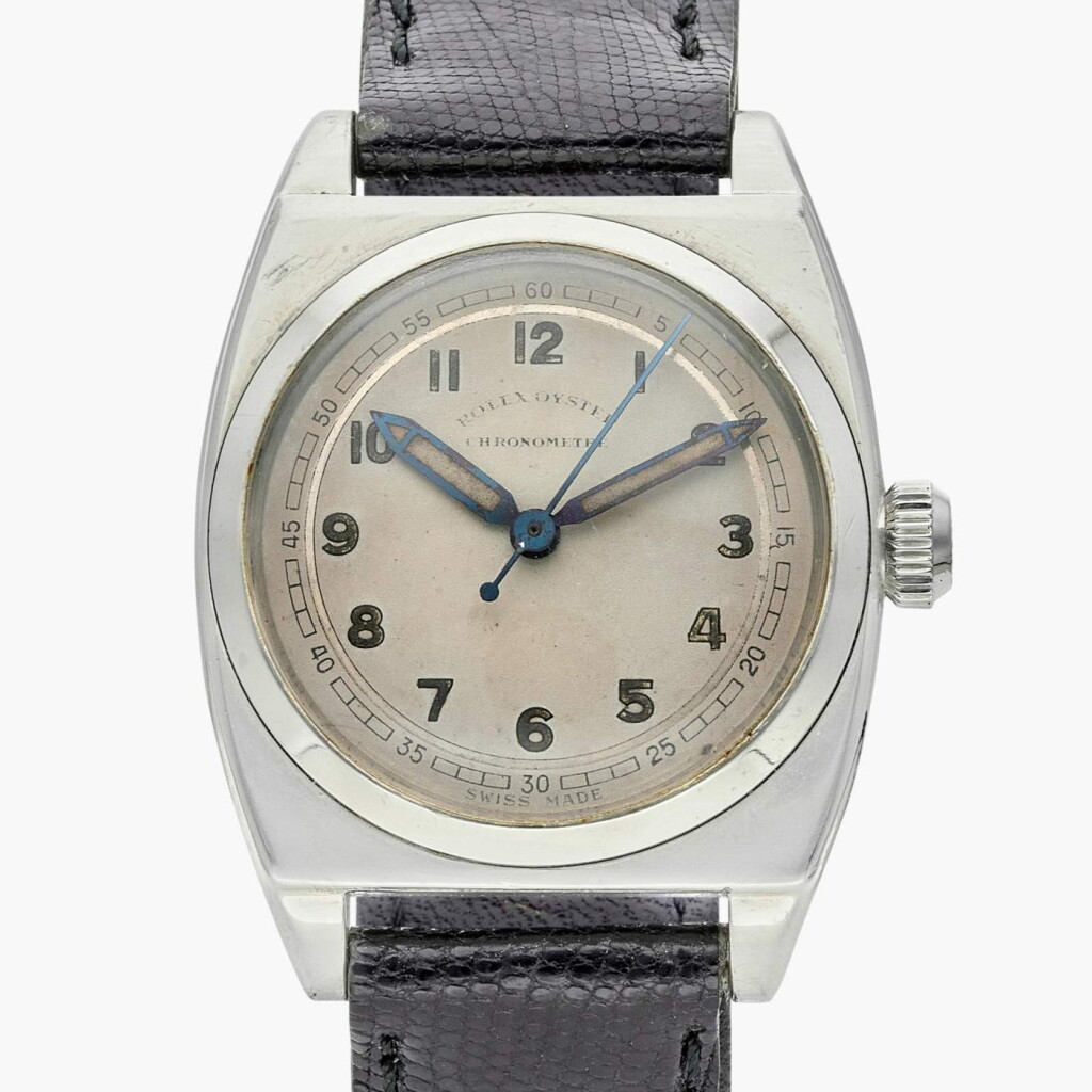 View full screen - View 1 of Lot 405. Reference 3121 | A stainless steel cushion-shaped wristwatch, Circa 1943.