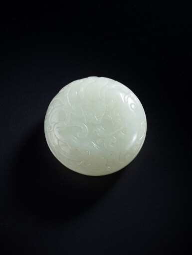View full screen - View 1 of Lot 127. A small celadon jade circular box and cover, Qing dynasty, 18th / 19th century.