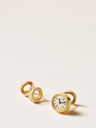 View full screen - View 1 of Lot 2238. An elegant pair of yellow gold cufflinks, one inset with a watch, Circa 1940 .