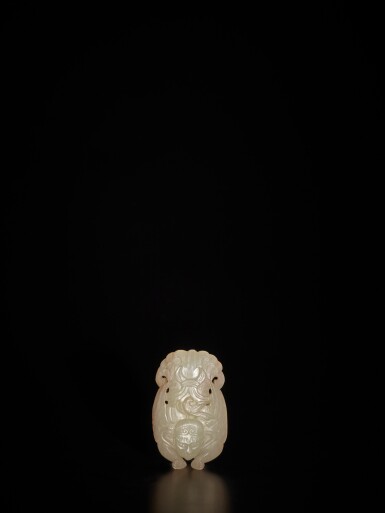 View full screen - View 1 of Lot 212. A pale celadon jade 'Garuda' slide, Qing dynasty | 清 青白玉雕迦樓羅飾.
