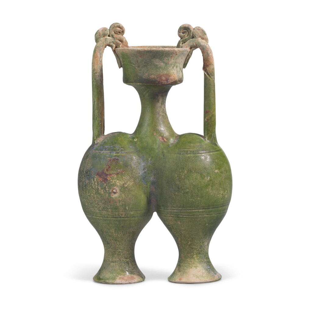 View full screen - View 1 of Lot 216. A RARE GREEN-GLAZED CONJOINED AMPHORA, SUI DYNASTY | 隋 綠釉雙龍柄聯腹傳瓶.