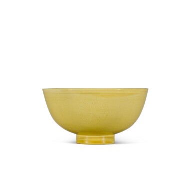 View full screen - View 1 of Lot 5. A incised yellow-glazed 'floral' bowl, Mark and period of Kangxi | 清康熙 黃釉刻團花紋盌 《大清康熙年製》款.