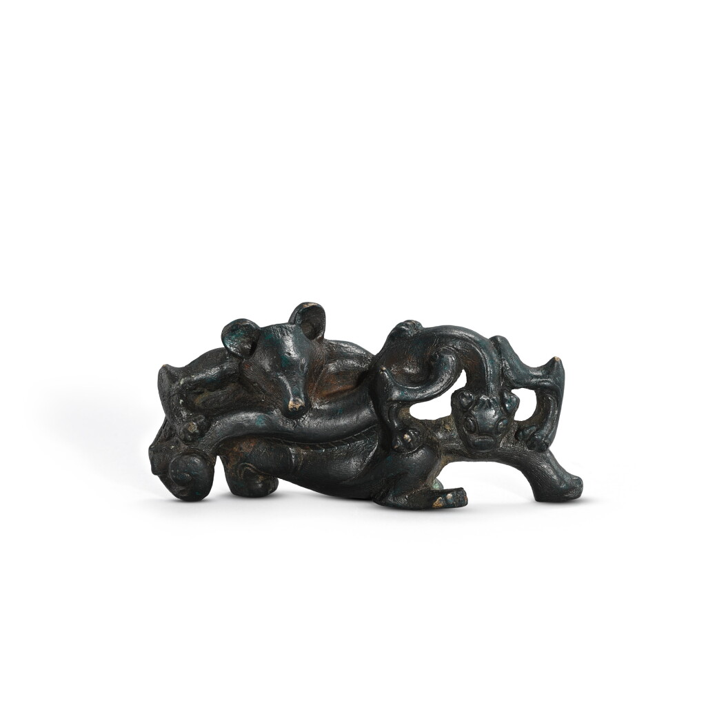 View full screen - View 1 of Lot 1047. A bronze 'bear and dragon' fitting, Han dynasty | 漢 青銅熊龍鬥飾件.