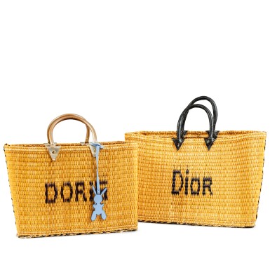 View full screen - View 1 of Lot 322. Two wicker baskets with leather handles, bearing the inscriptions: “Dior and Doris”.