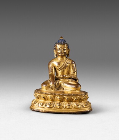 View full screen - View 1 of Lot 64. A gilt-copper alloy figure of Shakyamuni Buddha Tibet, 13th-14th century | 西藏 十三至十四世紀 鎏金銅合金釋迦牟尼佛坐像.