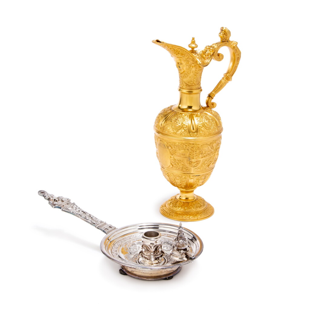 View full screen - View 1 of Lot 1378. A Victorian silver-gilt ‘Cellini’ pattern ewer, Charles Boyton, London, 1884; together with a Victorian silver chamberstick, George Fox for C.T. & G. Fox, London, 1877.