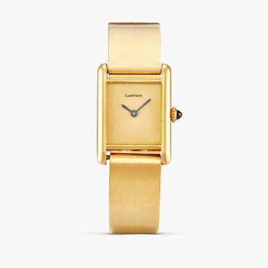 View full screen - View 1 of Lot 2467. New York retailed | Tank L.C. | A rectangular yellow gold wristwatch with detachable gold bangle-form bracelet and integrated deployant buckle, Circa 1975.