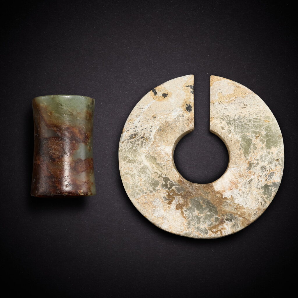 View full screen - View 1 of Lot 6814. A celadon jade tubular bead and a celadon jade slit ring, jue, Neolithic period - early Shang dynasty | 新石器時代至商早期 青玉管及玉玦.