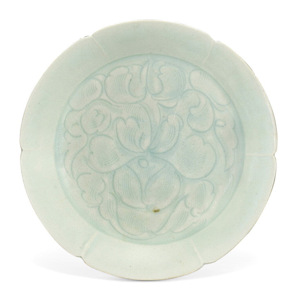 View full screen - View 1 of Lot 304. A QINGBAI 'FLORAL' DISH SONG DYNASTY | 宋 青白釉刻花卉紋葵口盤.