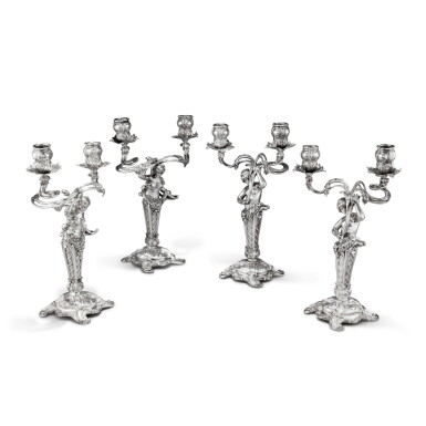 View full screen - View 1 of Lot 377. A German set of two pairs of two-light candlesticks, Wilkens, Bremen, circa 1900 | Ensemble de deux paires de chandelier à deux lumières par Wilkens, Brême, vers 1900.