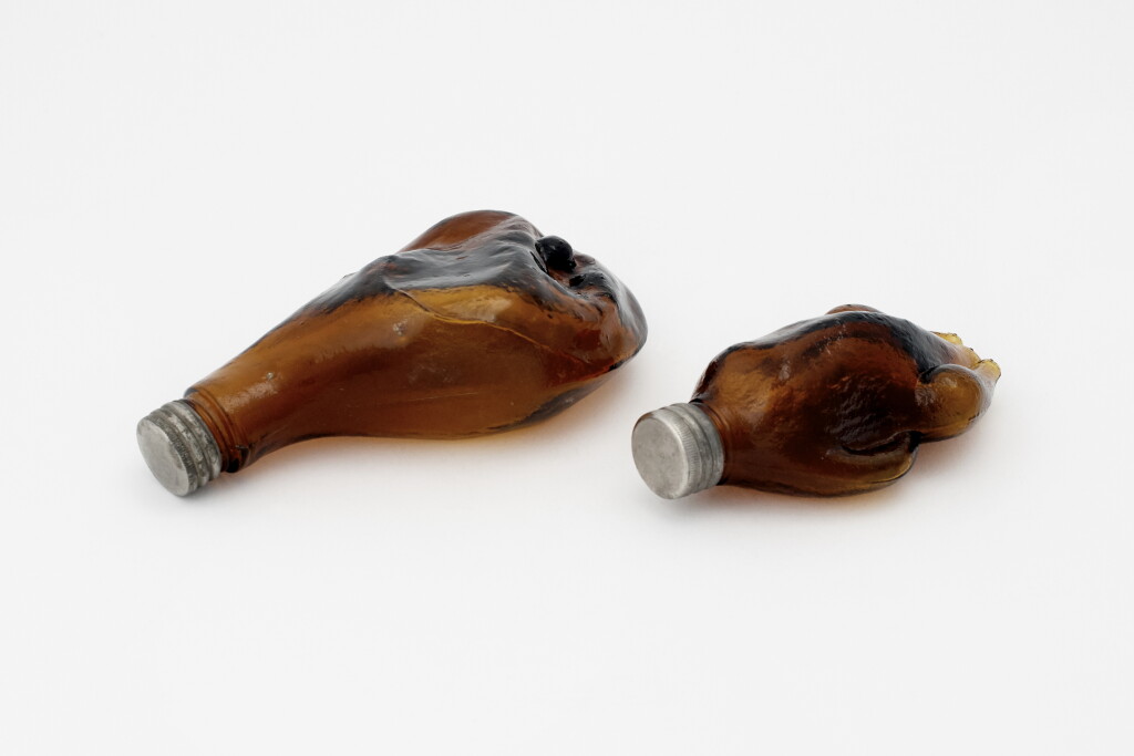 View full screen - View 1 of Lot 28. TWO MOLDED GLASS FLASKS .