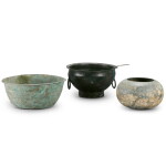 A group of three archaic bronze bowls, Han dynasty | 漢 銅佛鉢、銅饕餮鋪首活環耳洗 及 銅洗一組三件