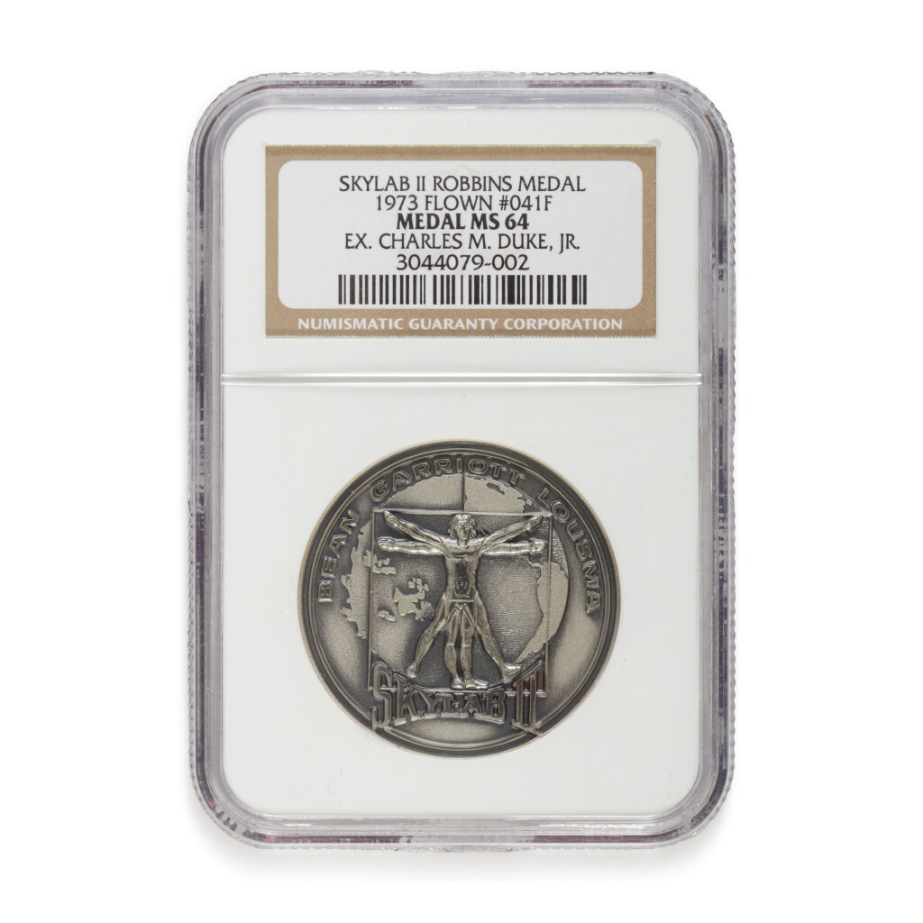View full screen - View 1 of Lot 215. FLOWN ON SKYLAB II (SL-3). APOLLO ASTRONAUT CHARLES DUKE'S SKYLAB II SILVER ROBBINS MEDALLION.