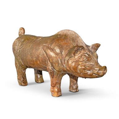 View full screen - View 1 of Lot 23. An amber-glazed pottery figure of a boar, Han dynasty.