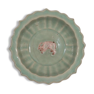 View full screen - View 1 of Lot 2. An exceedingly rare biscuit-reserved barbed-rim 'Longquan' celadon-glazed 'bear' dish, Yuan dynasty, Yanyou reign, corresponding to 1314-1320.