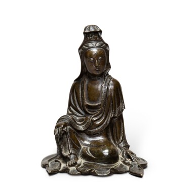 View full screen - View 1 of Lot 202. A bronze figure of seated Guanyin Qing dynasty, 18th-19th century | 清十八至十九世紀 銅鑄觀音坐像.