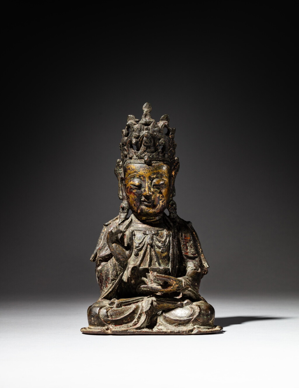 View full screen - View 1 of Lot 51. A parcel-gilt bronze seated Guanyin, Ming dynasty | 明 局部鎏金銅觀音坐像.