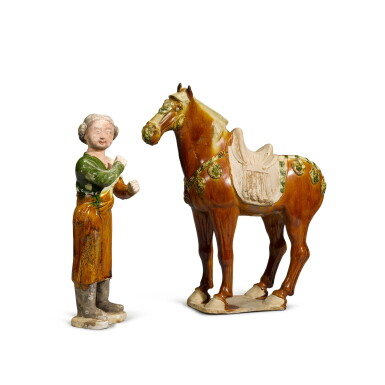 View full screen - View 1 of Lot 107. A sancai-glazed figure of a caparisoned horse and a groom, Tang dynasty | 唐 三彩馬及馬夫俑.