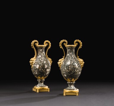 View full screen - View 1 of Lot 74. A PAIR OF LOUIS XVI GILT-BRONZE MOUNTED TRACHYANDÉSITE MARBLE VASES LATE 18TH CENTURY.