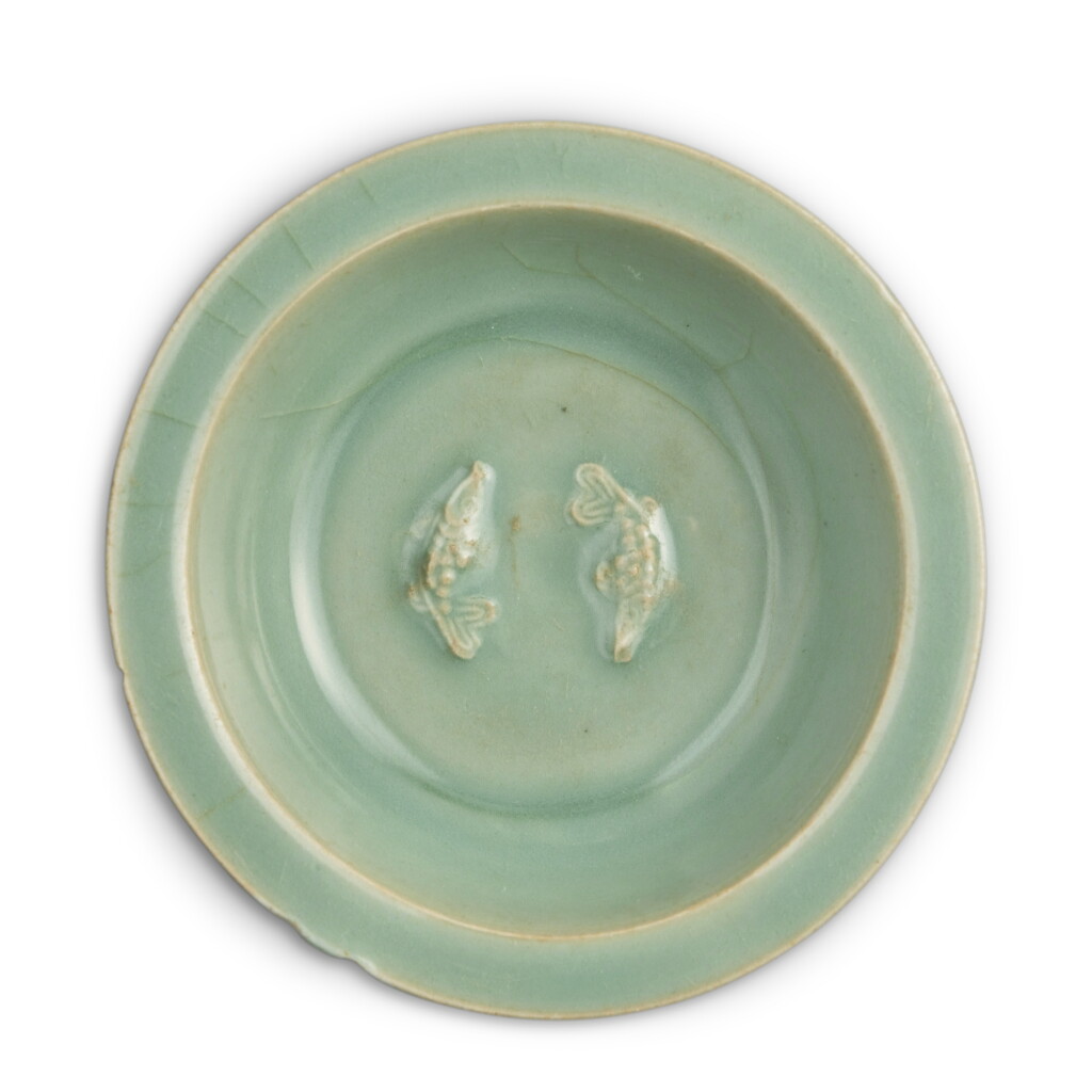 View full screen - View 1 of Lot 135. A molded 'Longquan' celadon-glazed 'double fish' dish, Southern Song dynasty .