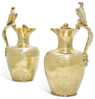 View full screen - View 1 of Lot 139. ROYAL. A PAIR OF WILLIAM IV SILVER-GILT CLARET JUGS, ONE JOHN BRIDGE FOR RUNDELL, BRIDGE & RUNDELL, 1833, THE OTHER JOHN SPARKES TAPLEY FOR JOHN TAPLEY & CO., 1835, BOTH LONDON, RETAILED BY RUNDELL, BRIDGE & CO..