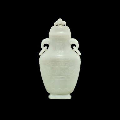 View full screen - View 1 of Lot 195. A white jade archaistic 'taotie' vase and cover, Qing dynasty, Qianlong period | 清乾隆 白玉仿古饕餮紋活環蓋瓶.
