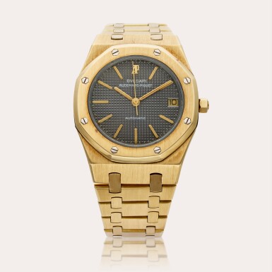 View full screen - View 1 of Lot 355. Reference 4100BA Royal Oak | Retailed by Bulgari: A yellow gold automatic wristwatch with date and bracelet, Circa 1977.